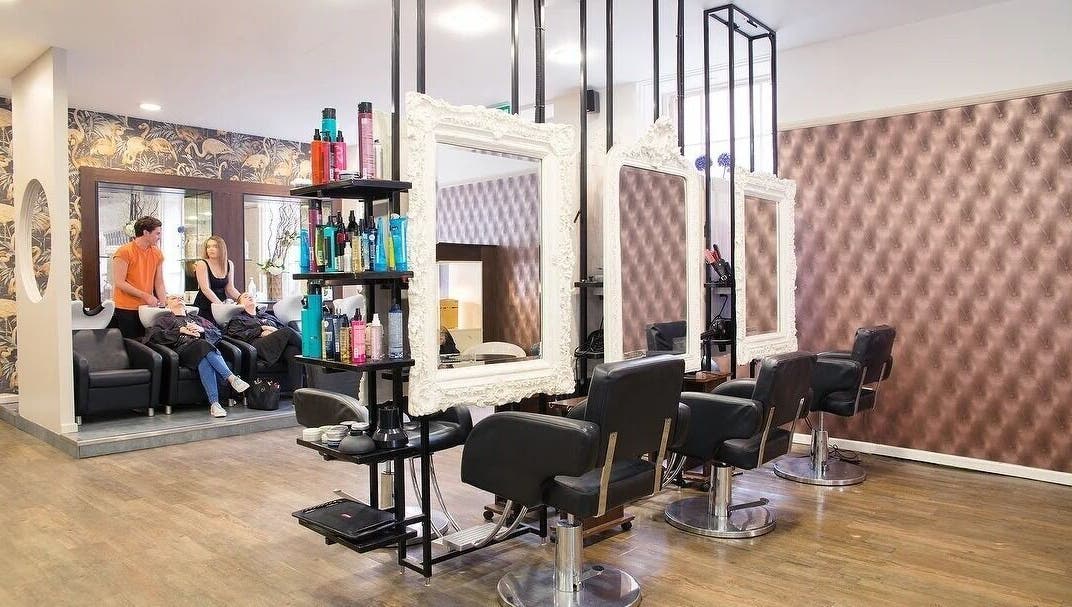 Interior of Renegade hair studio in Leeds, England, GB with modern stations and stylish decor.