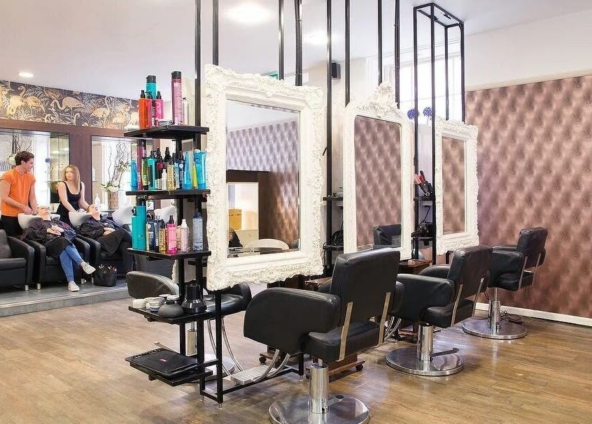 Interior of Renegade hair studio in Leeds, England, GB with modern stations and stylish decor.