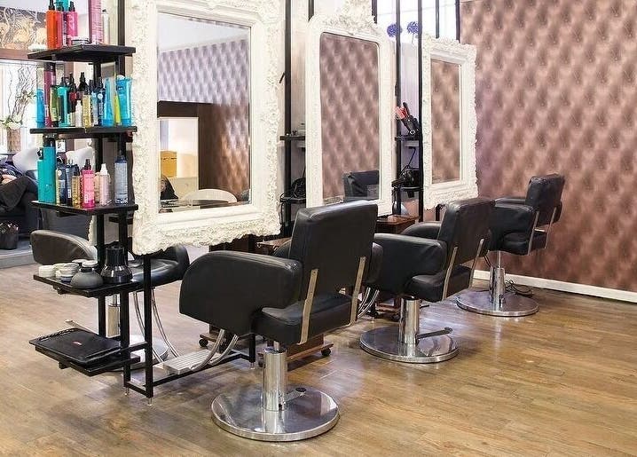 Renegade Hair Studio in Leeds, England, GB, featuring elegant salon chairs and stylish decor.