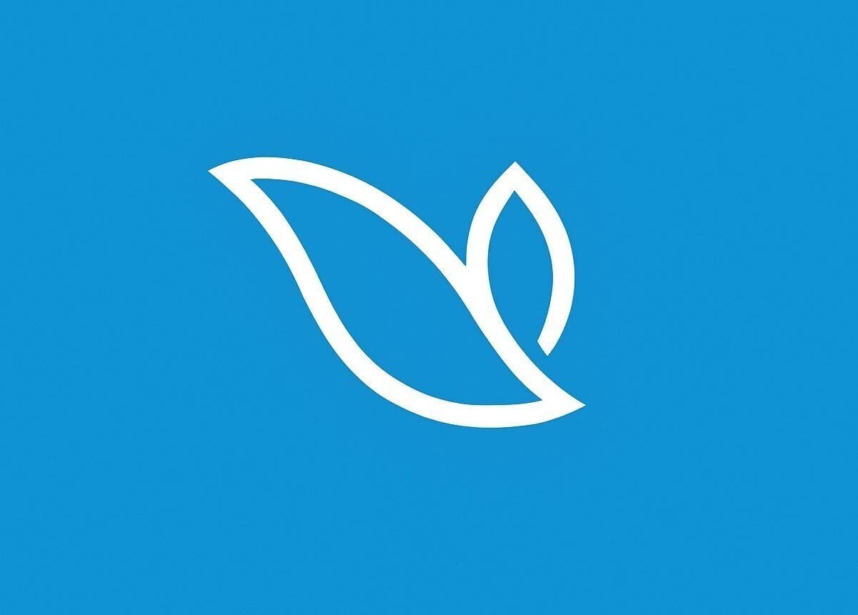 Luxury Beauty & Spa logo with white leaf design on blue background, London, England, GB.