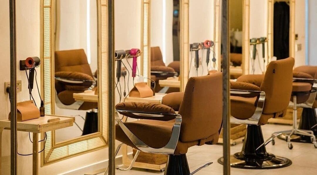 Elegant salon chairs with mirrors at Insyra Salon, Ahmedabad, Gujarat, IN.