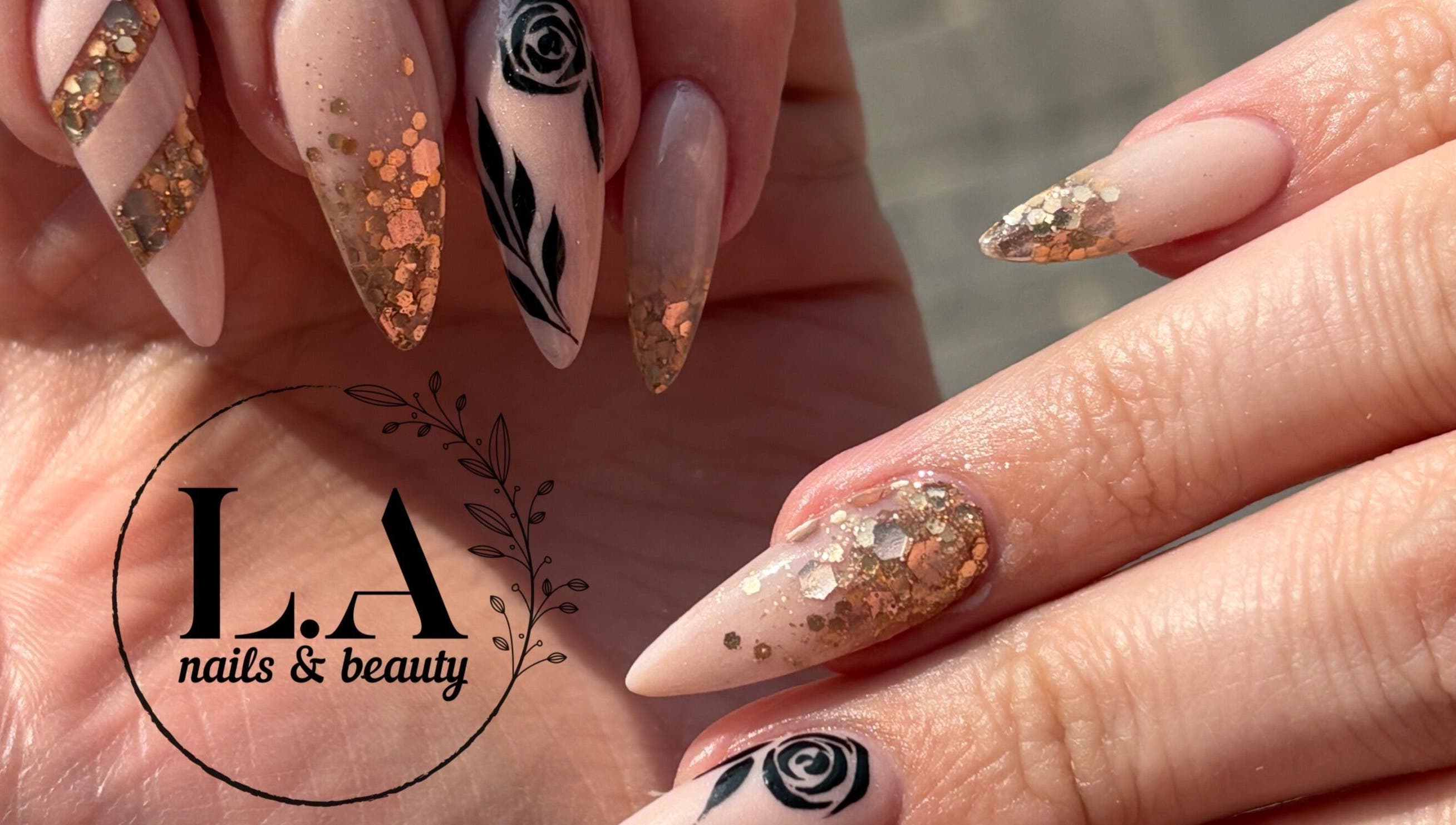 Elegant nail art with gold and black at L.A nails & beauty, Centurion, Gauteng, ZA.