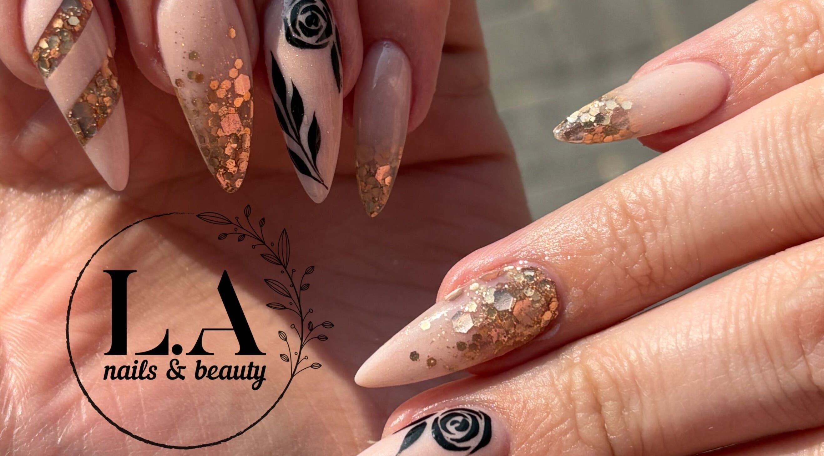 Elegant nail art with gold and black at L.A nails & beauty, Centurion, Gauteng, ZA.