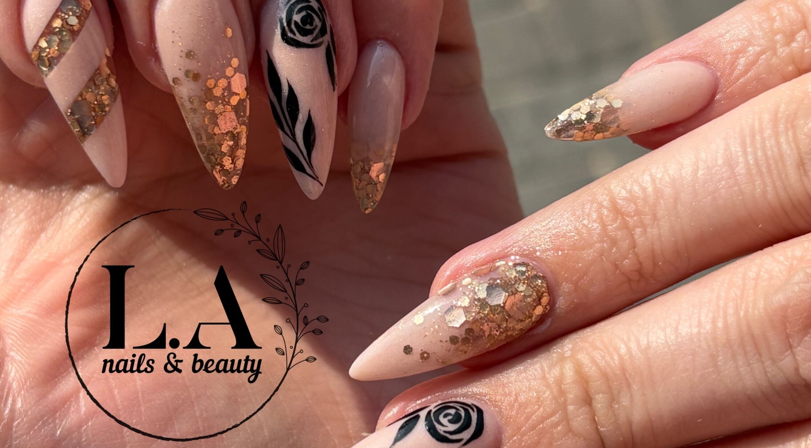 Elegant nail art with gold and black at L.A nails & beauty, Centurion, Gauteng, ZA.