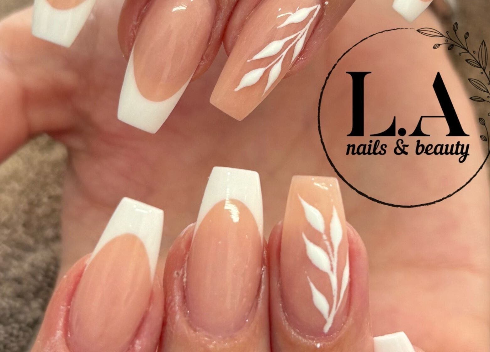 French manicure with white leaf design at L.A nails & beauty, Centurion, Gauteng, ZA.