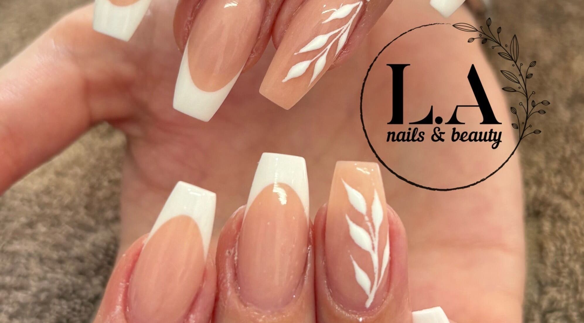 French manicure with white leaf design at L.A nails & beauty, Centurion, Gauteng, ZA.