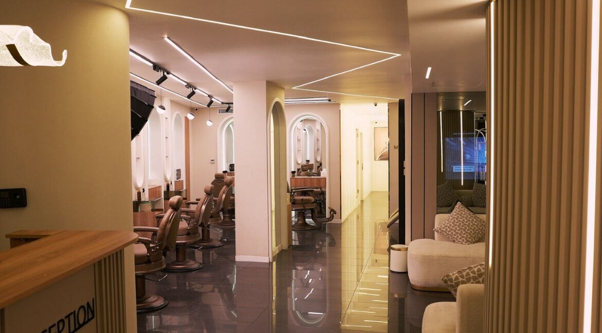Modern interior of Ali Wehbi Salon in Beirut, showcasing luxurious styling chairs and elegant decor.