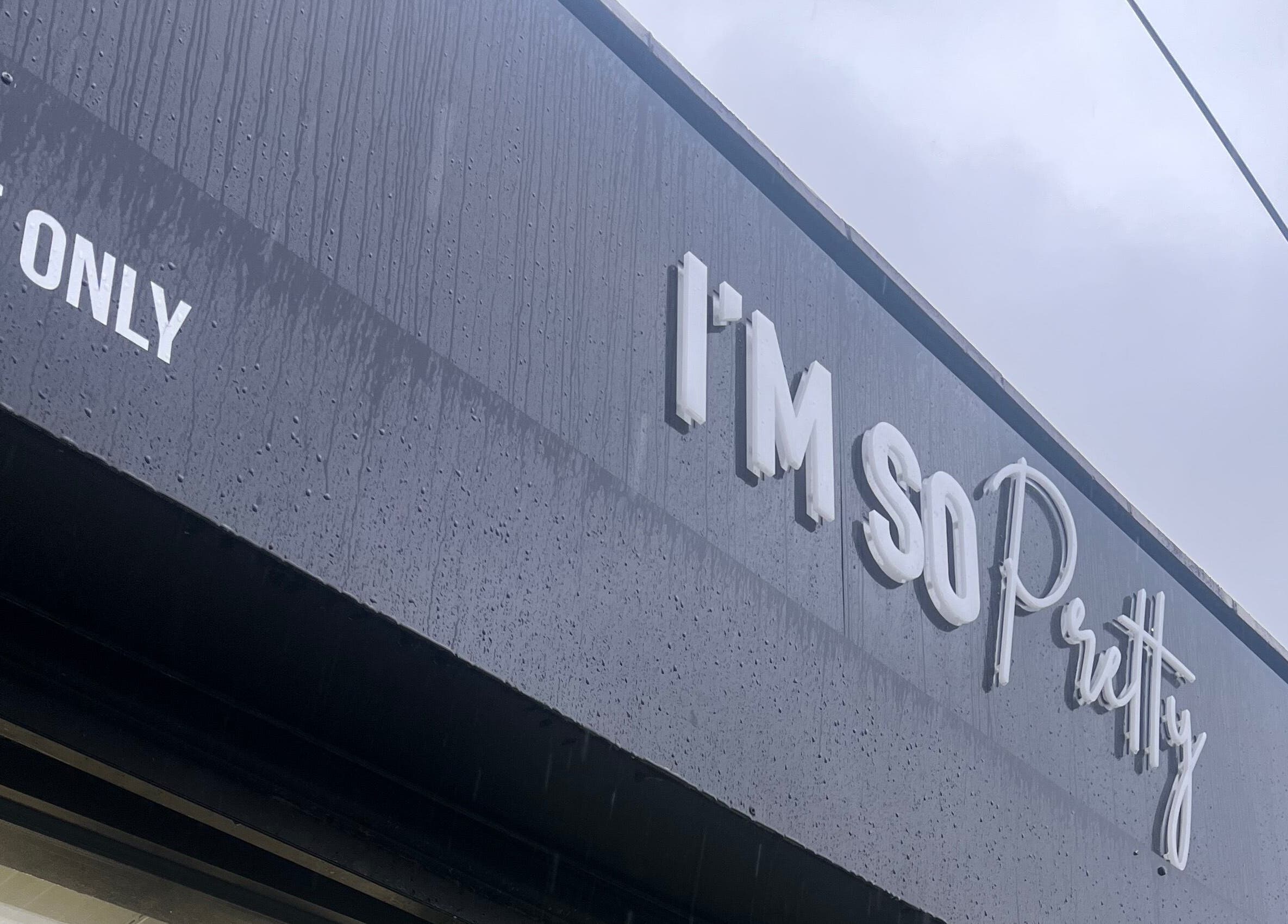 Exterior view of Lashmelovely, Liverpool, England, GB showcasing chic store signage in stylish font.