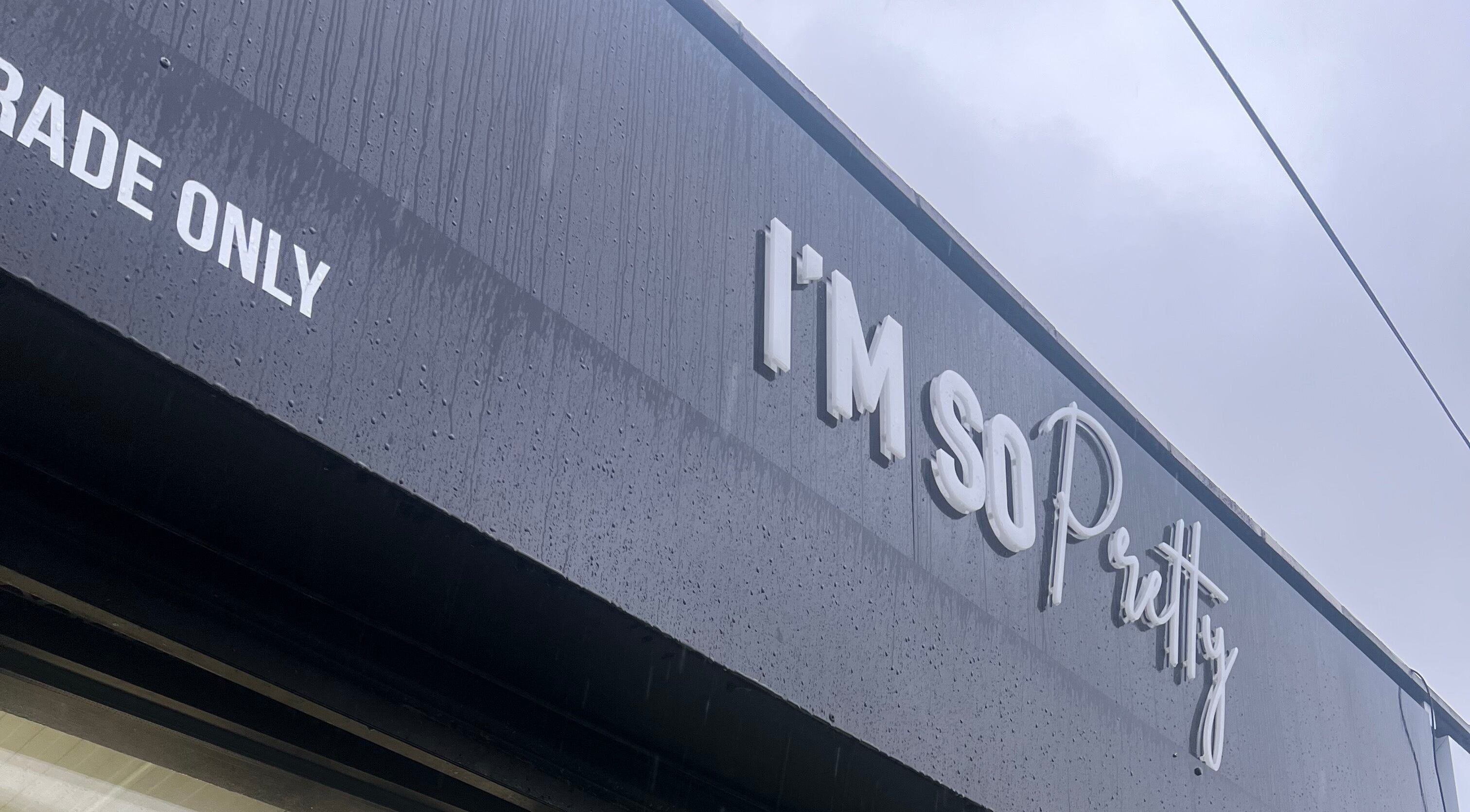 Exterior view of Lashmelovely, Liverpool, England, GB showcasing chic store signage in stylish font.