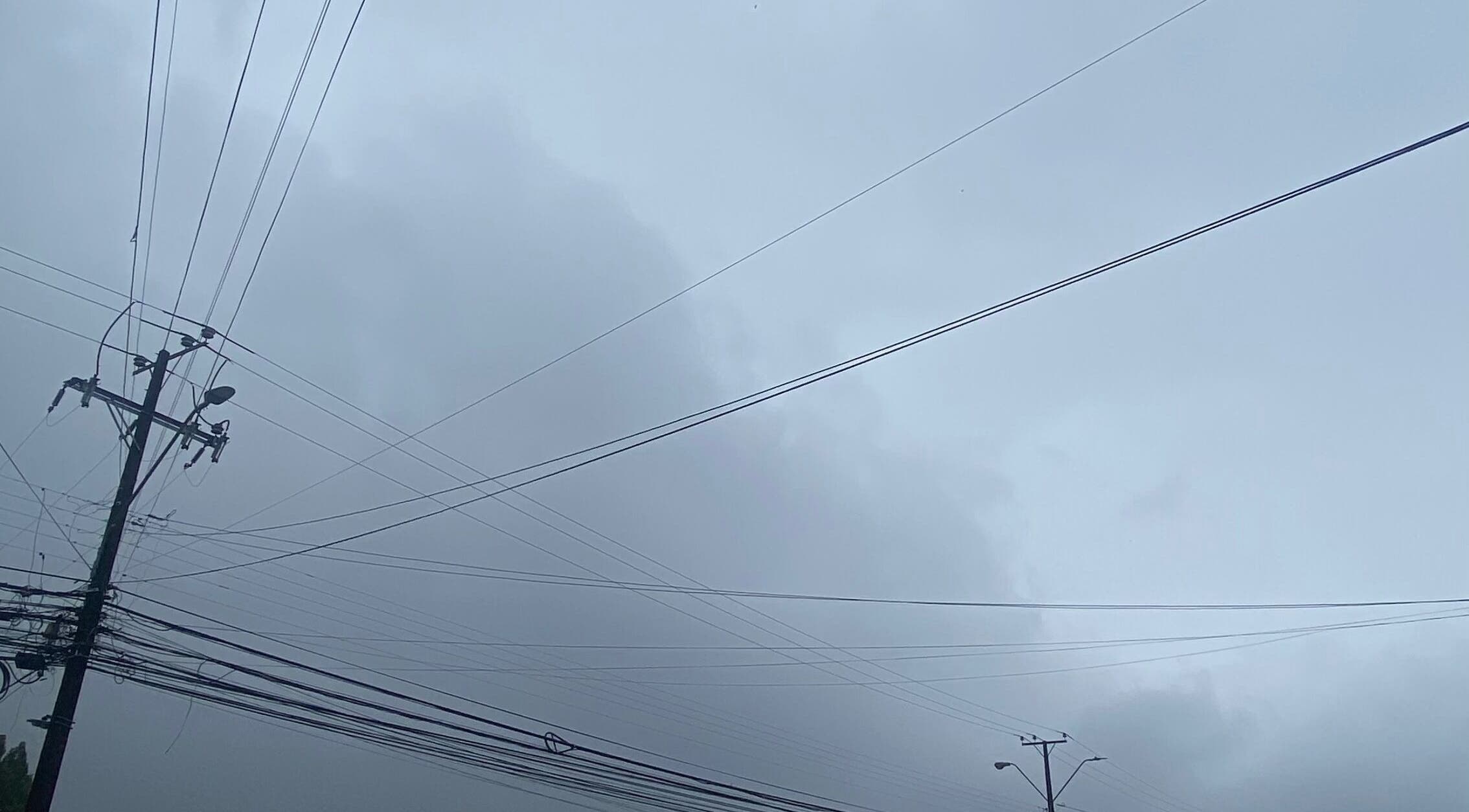 Overcast sky with power lines near Belen.nails.pm, Puerto Montt, Los Lagos, CL.