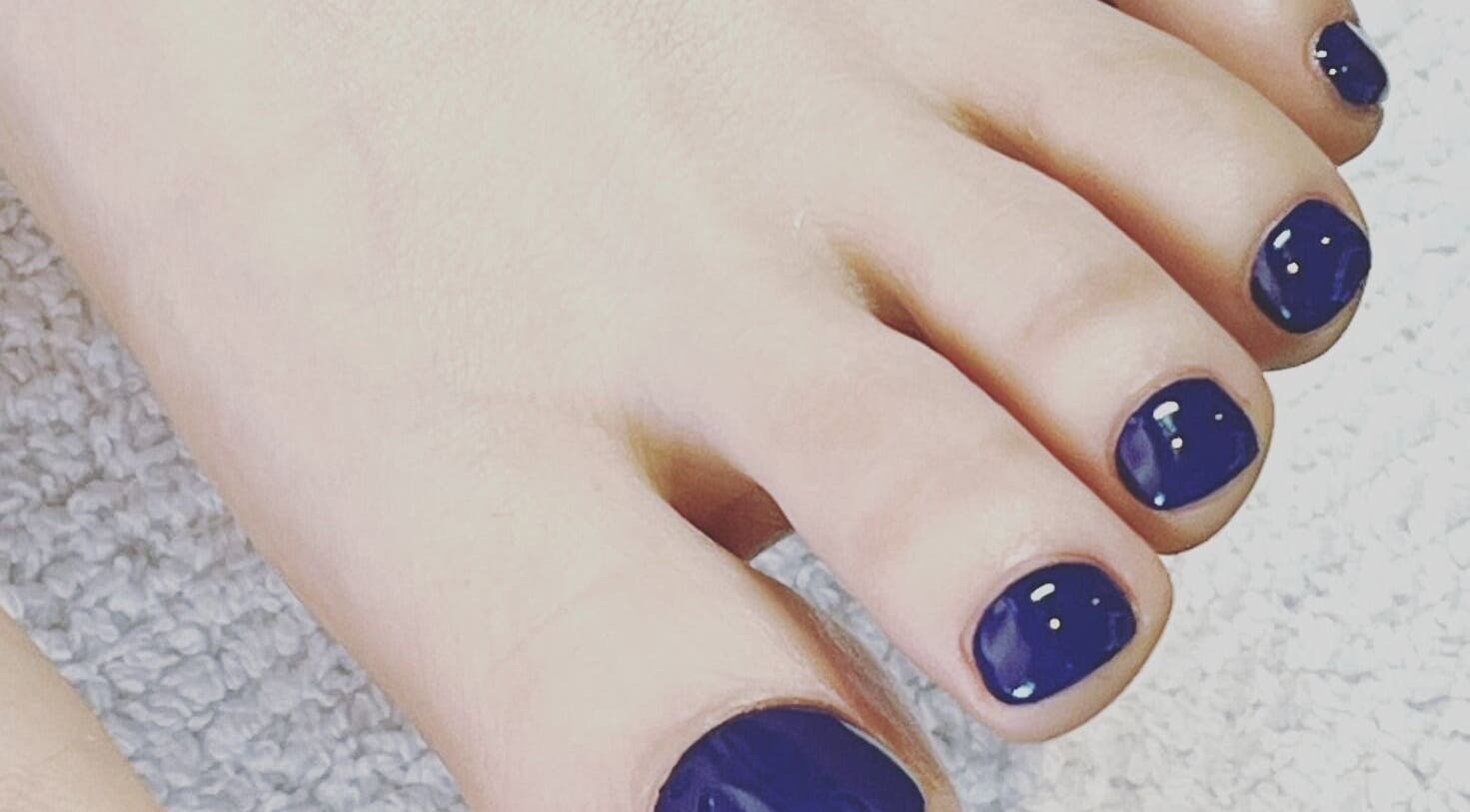 Navy blue pedicure at JuJu beauty studio, Auckland, Auckland, NZ showcasing nail art excellence.