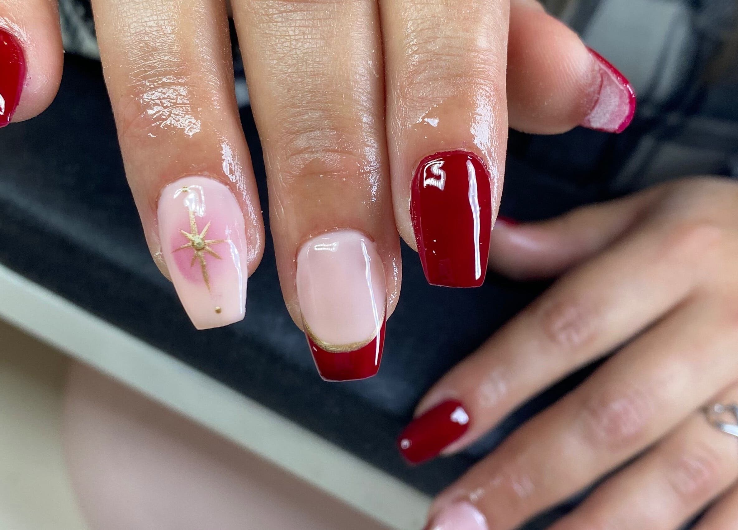 Red and nude manicure with star design at Caminnails, Mar Del Plata, Provincia De Buenos Aires, AR.