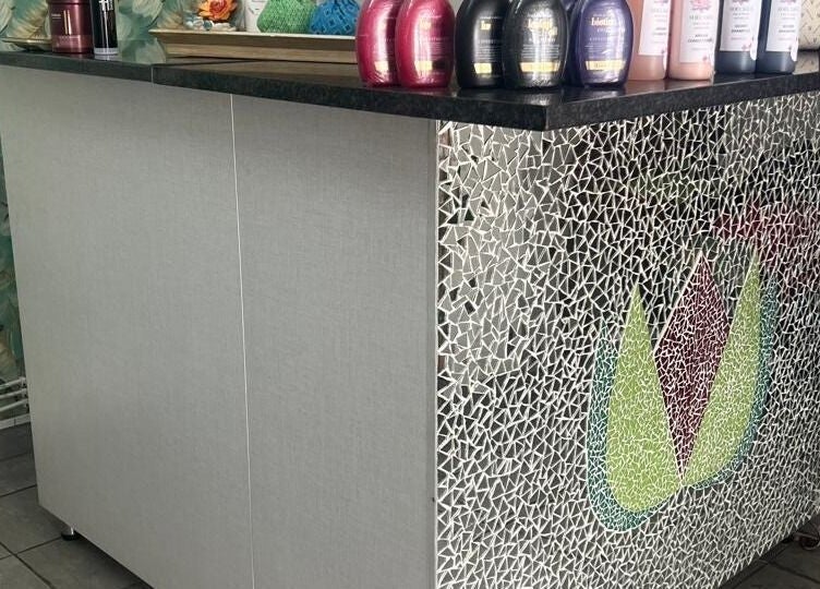 Reception area at Sheckies Hair and Beauty Salon in Cape Town, Western Cape, ZA with mosaic design.