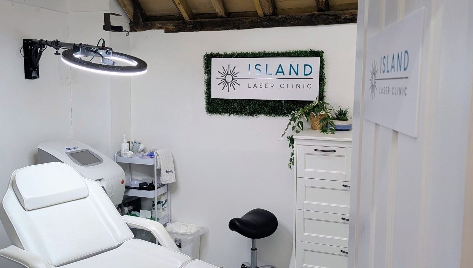 Relaxing treatment room at Island Laser Clinic, Hayling Island, England, GB, featuring a modern white chair.