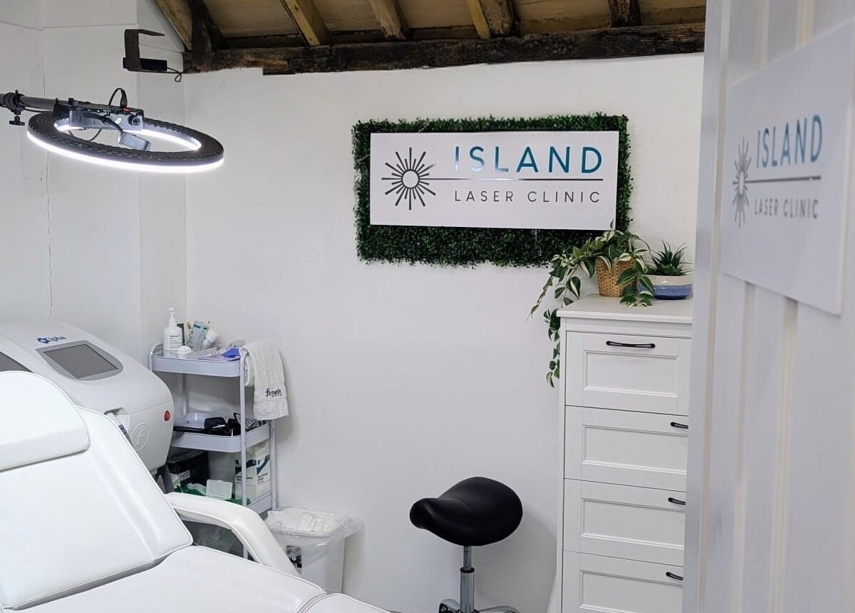 Relaxing treatment room at Island Laser Clinic, Hayling Island, England, GB, featuring a modern white chair.