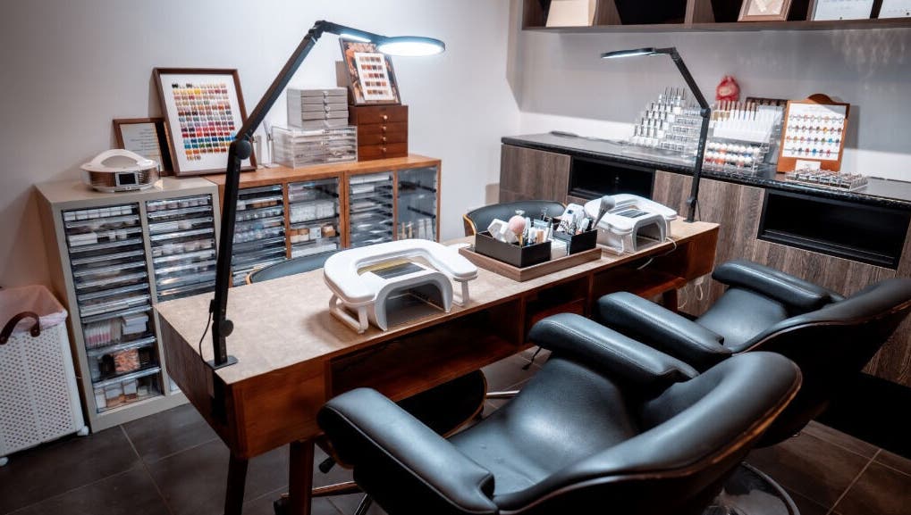 Sophisticated nail station at Last Quarter Nail, Melbourne, Victoria, AU with ample seating and organized supplies.
