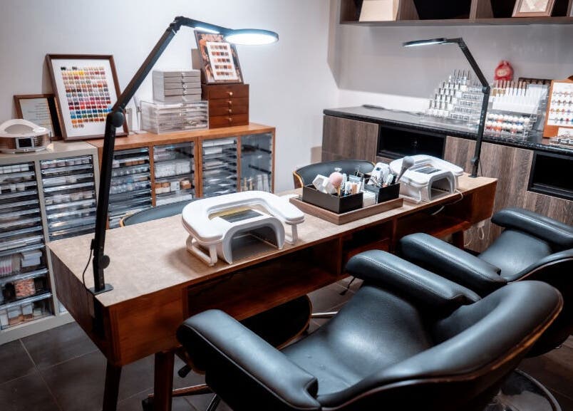Sophisticated nail station at Last Quarter Nail, Melbourne, Victoria, AU with ample seating and organized supplies.