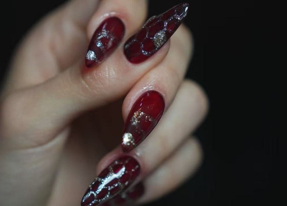 Stunning crimson nails with silver accents at Last Quarter Nail, Melbourne, Victoria, AU.