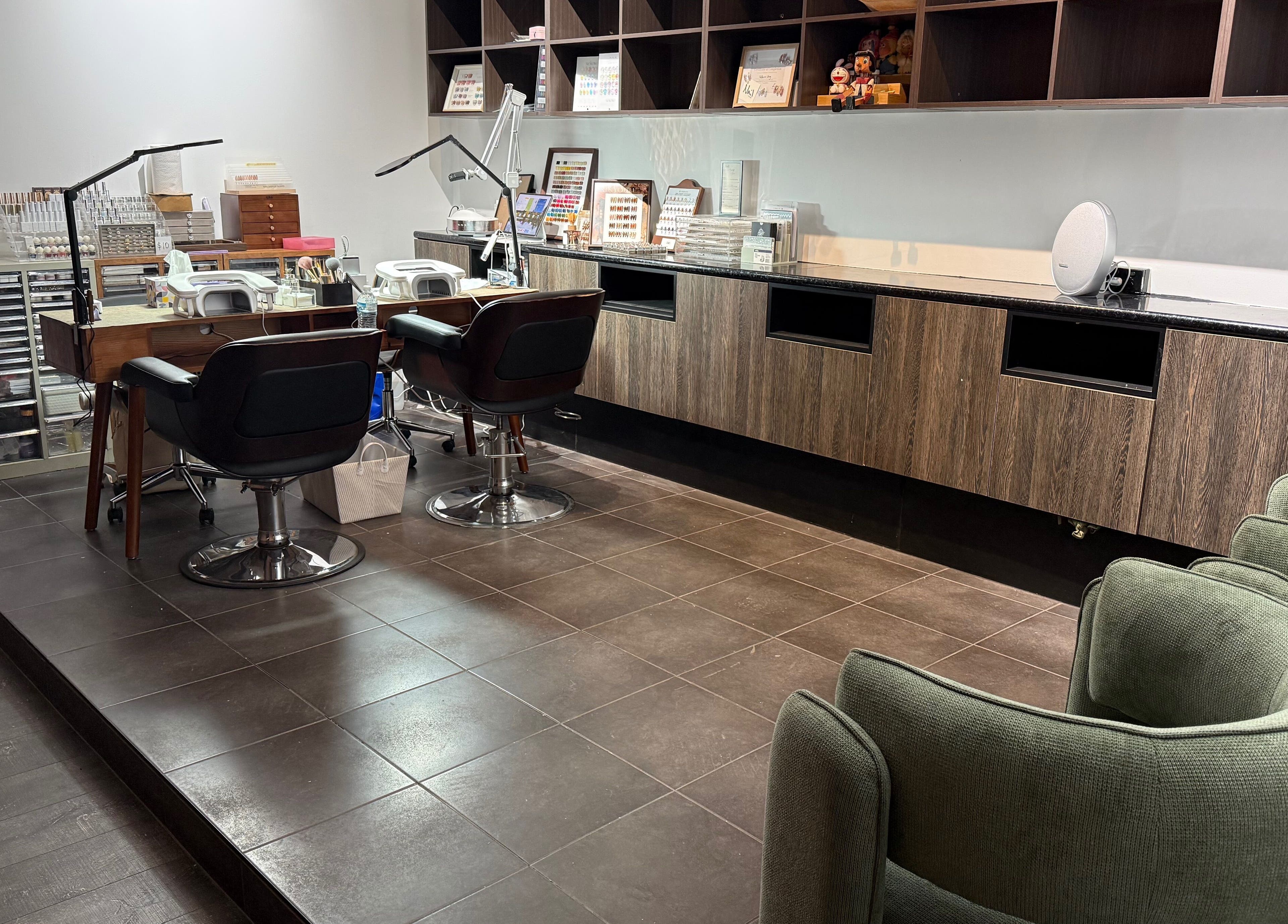 Modern nail salon setup at Last Quarter Nail, Melbourne, Victoria, AU with stylish seating and workstations.