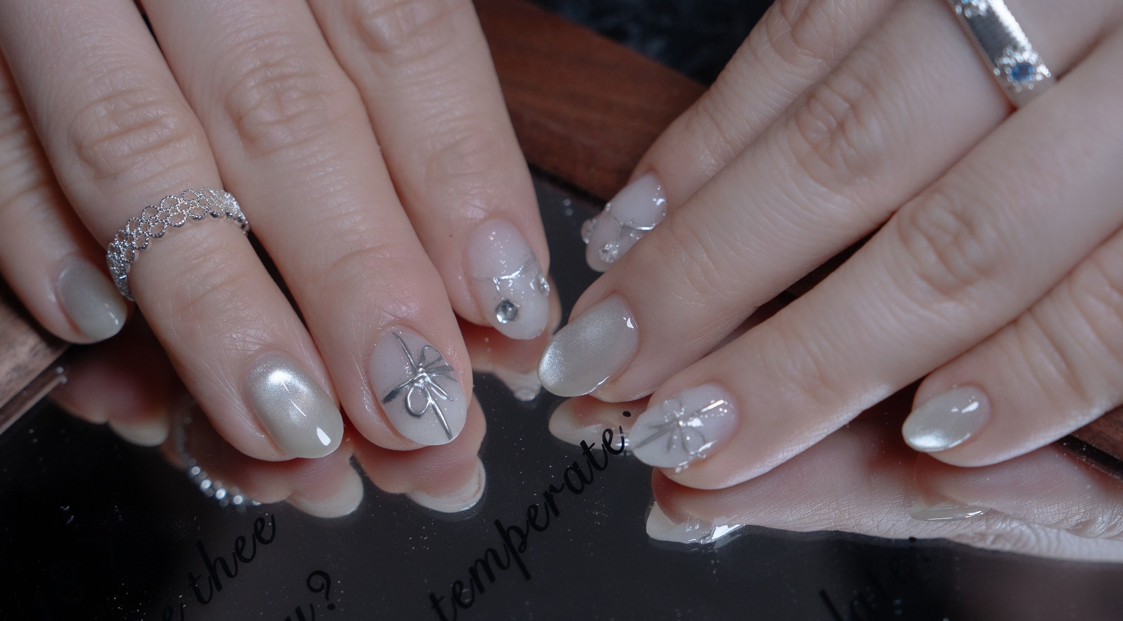 Stylish nail art with silver accents at Last Quarter Nail, Melbourne, Victoria, AU.