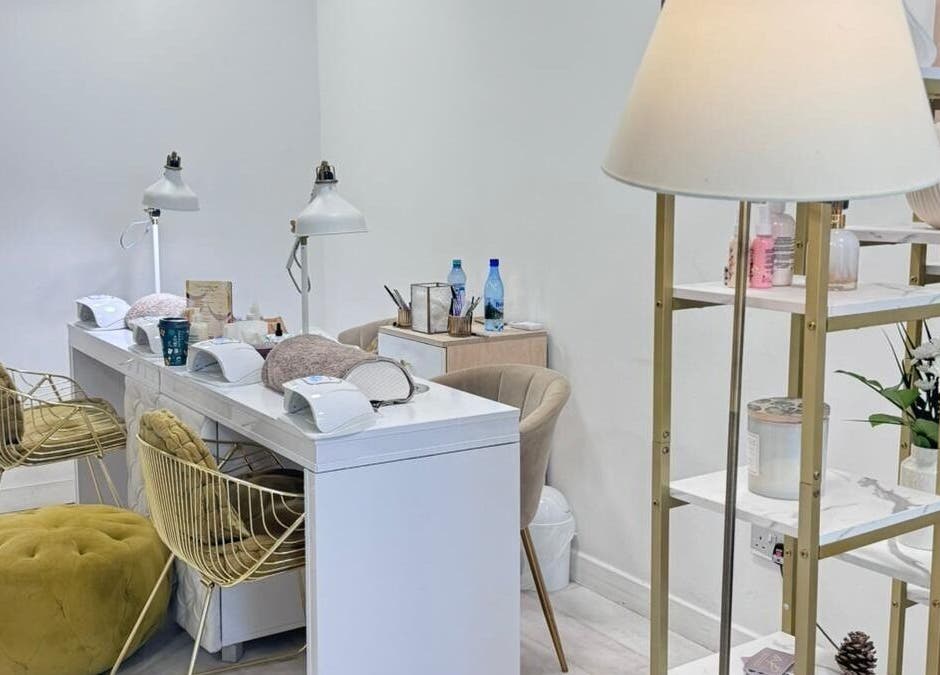 Chic nail salon interior at MP Nails and Beauty, Northampton, England, GB, featuring elegant decor and manicured stations.