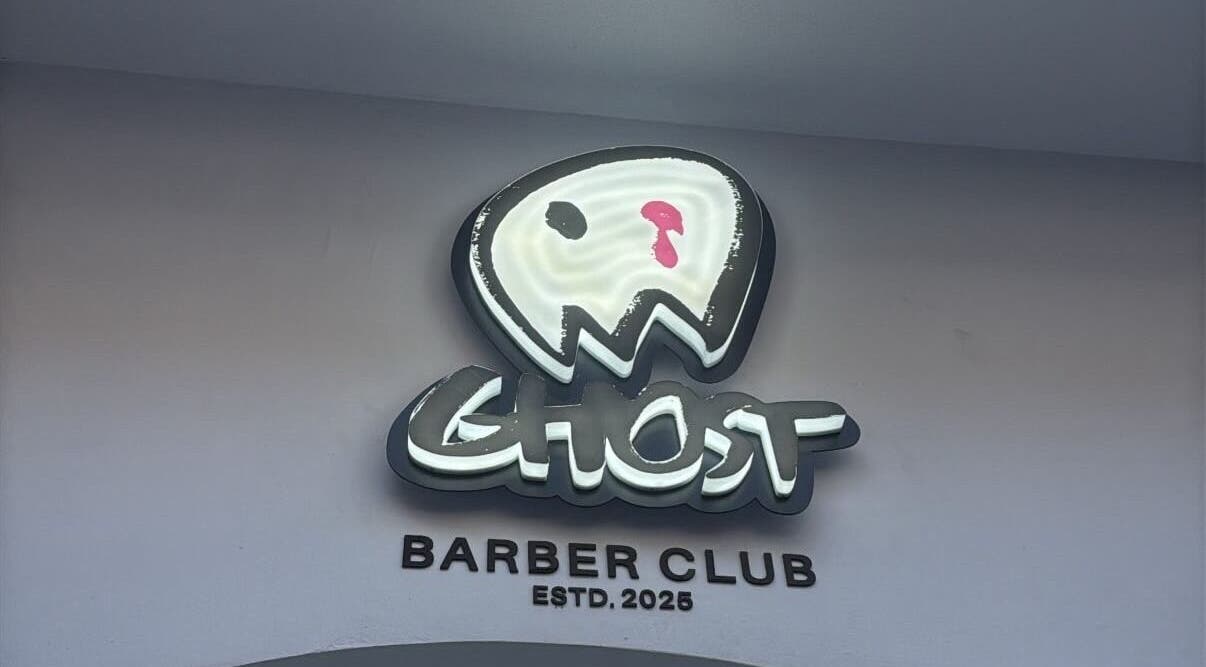 Ghost Barber Club logo sign at entrance, Volos, GR.