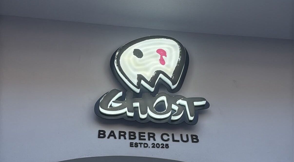 Ghost Barber Club logo sign at entrance, Volos, GR.