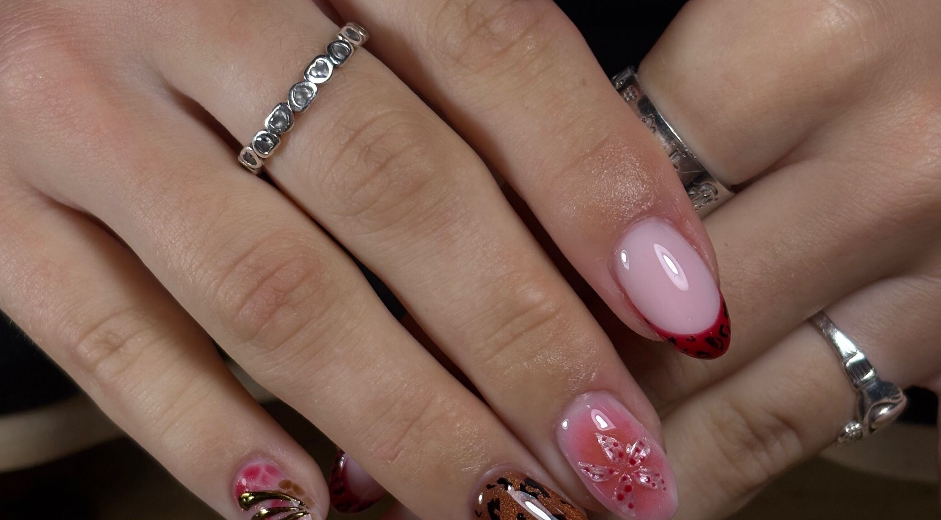 Colorful nail art from ligi.nails_ in Buncrana, County Donegal, IE showcasing intricate designs.