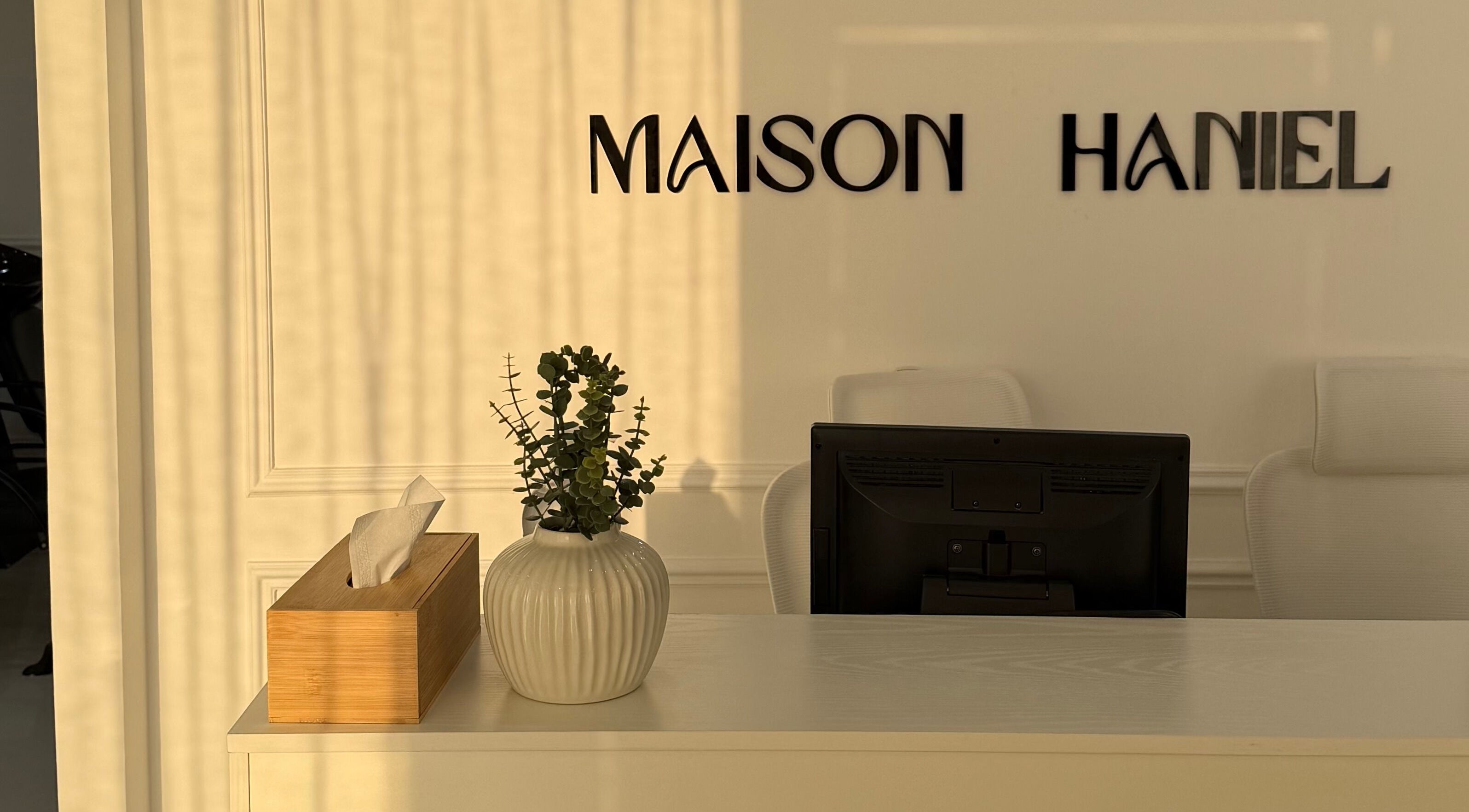 Reception desk at Maison Haniel with decor, Dubai, AE.