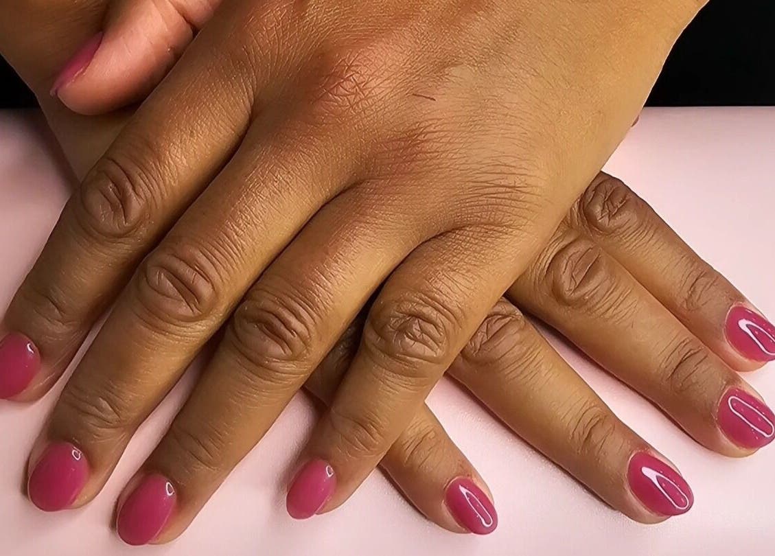 Elegant pink manicure at Nails by Julie @ Hair & Co London, showcasing beautiful nail artistry in London, England, GB.
