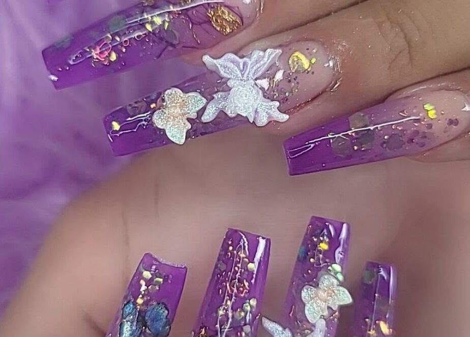 Purple floral nails art from Nails by Yuli in Greenacres, Florida, US.