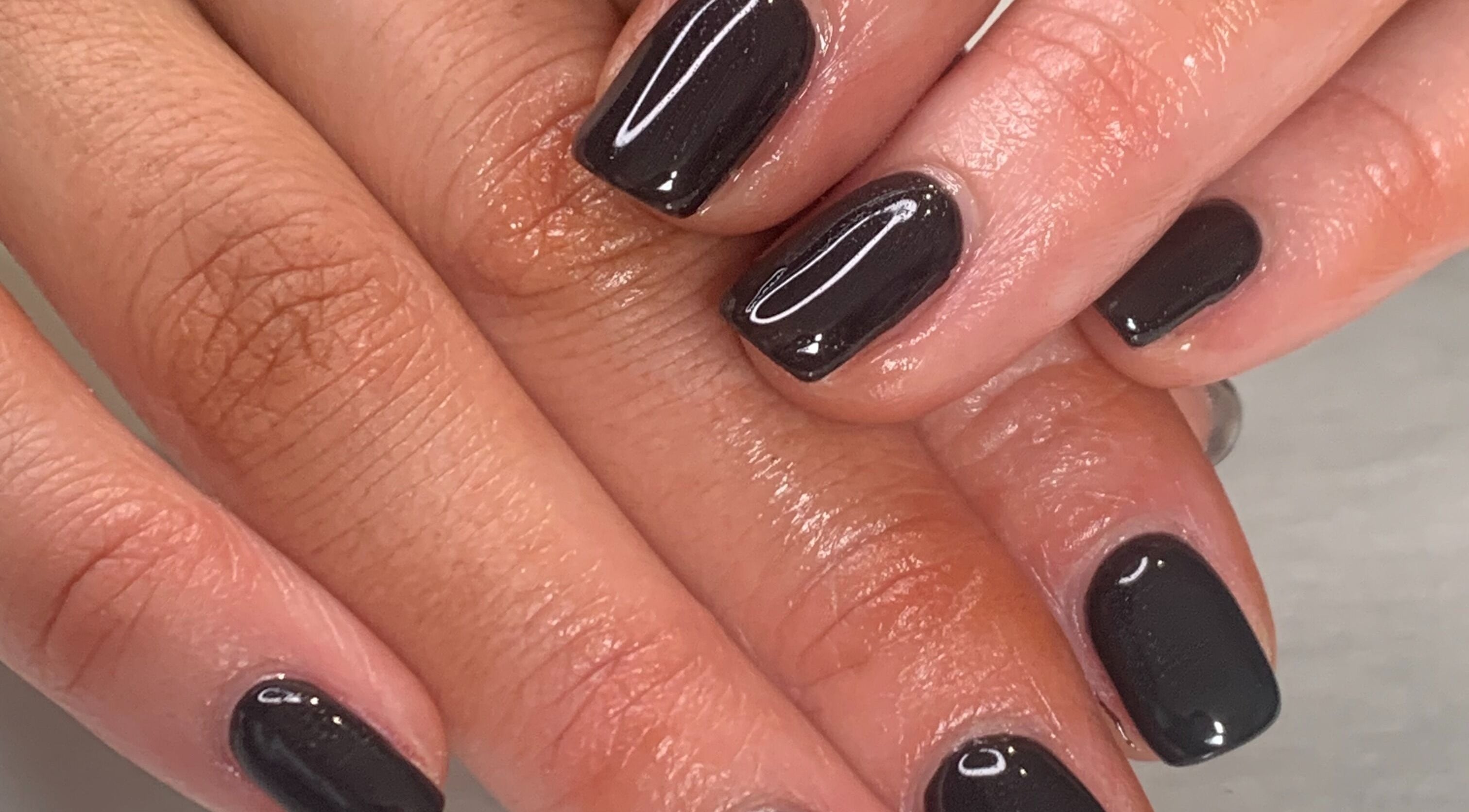 Chic black manicured nails at Aimée Carter, Thornton Dale, Pickering, England, GB.