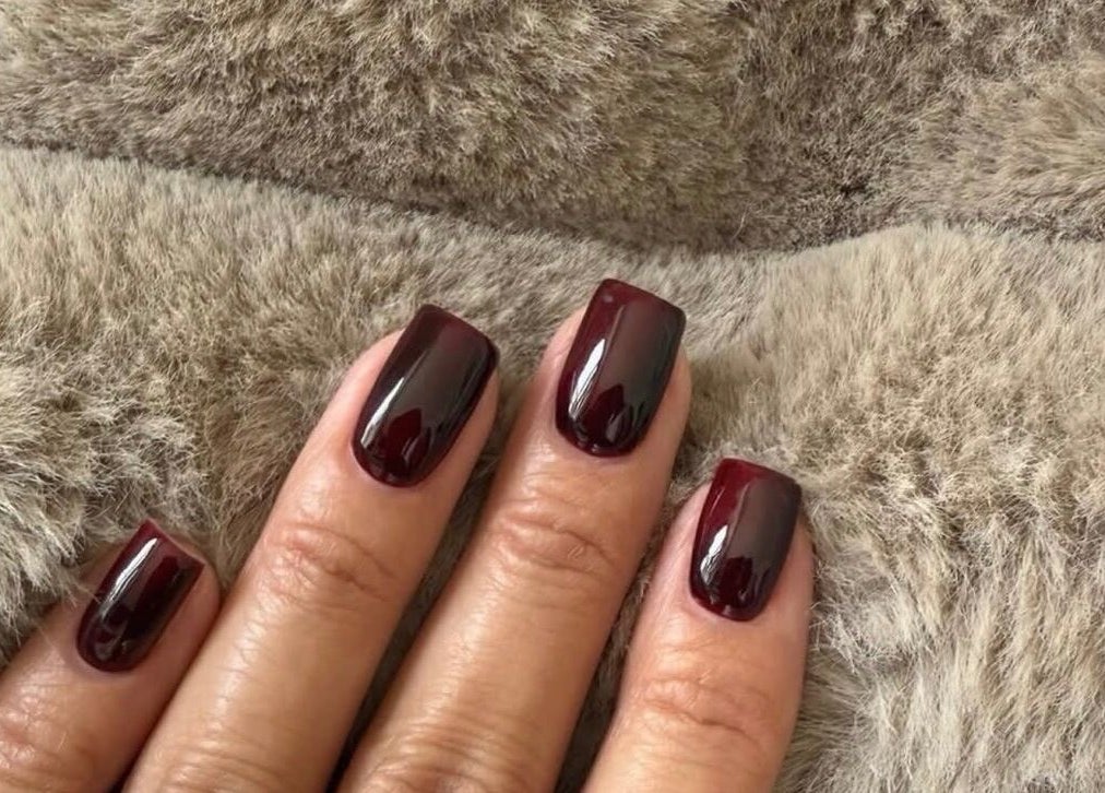 Beautiful maroon nails at Biab By Amber, featuring a chic manicure on soft fabric. Located in Watford, GB.