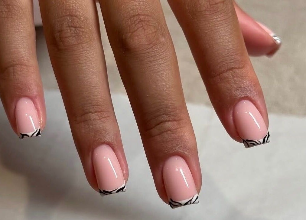 Elegant French tips manicure at Biab By Amber, Watford, GB. Perfect for a chic style.