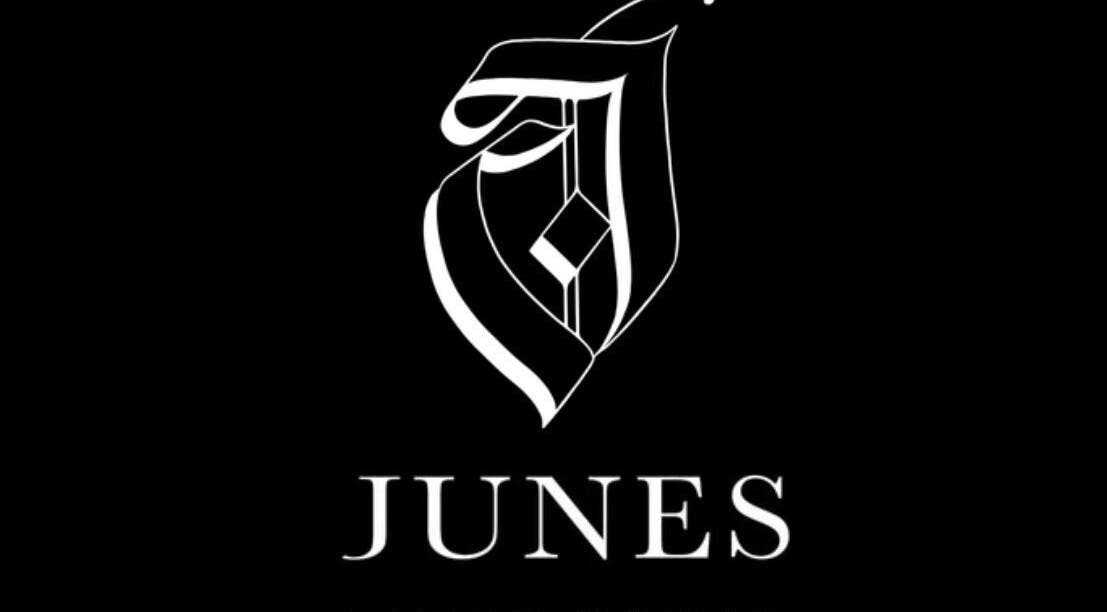 Elegant logo of Junes barber studio at Saint Morris, South Australia, AU on a sleek black background.