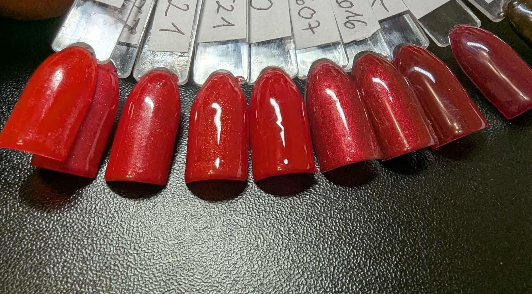Vibrant red nail polish shades at Agi Nails, Bulwark, Wales, GB showcasing bold beauty options.
