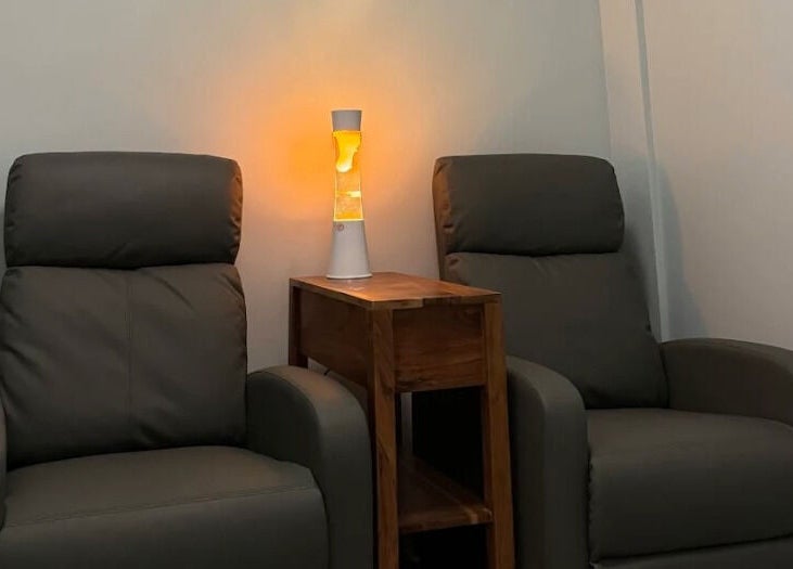 Relax Day Spa's cozy seating area with soft lighting in New York, New York, US.