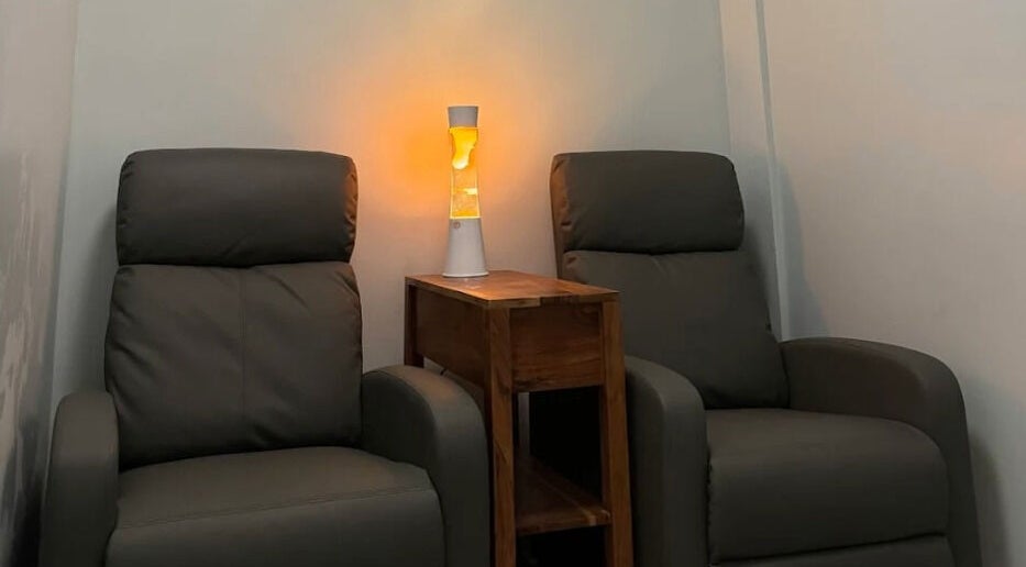 Relax Day Spa's cozy seating area with soft lighting in New York, New York, US.