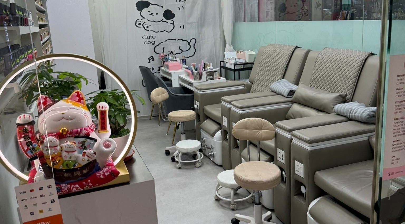Luxurious nail salon seating at J&J Beauty, Singapore, SG with cozy pedicure chairs and decor.