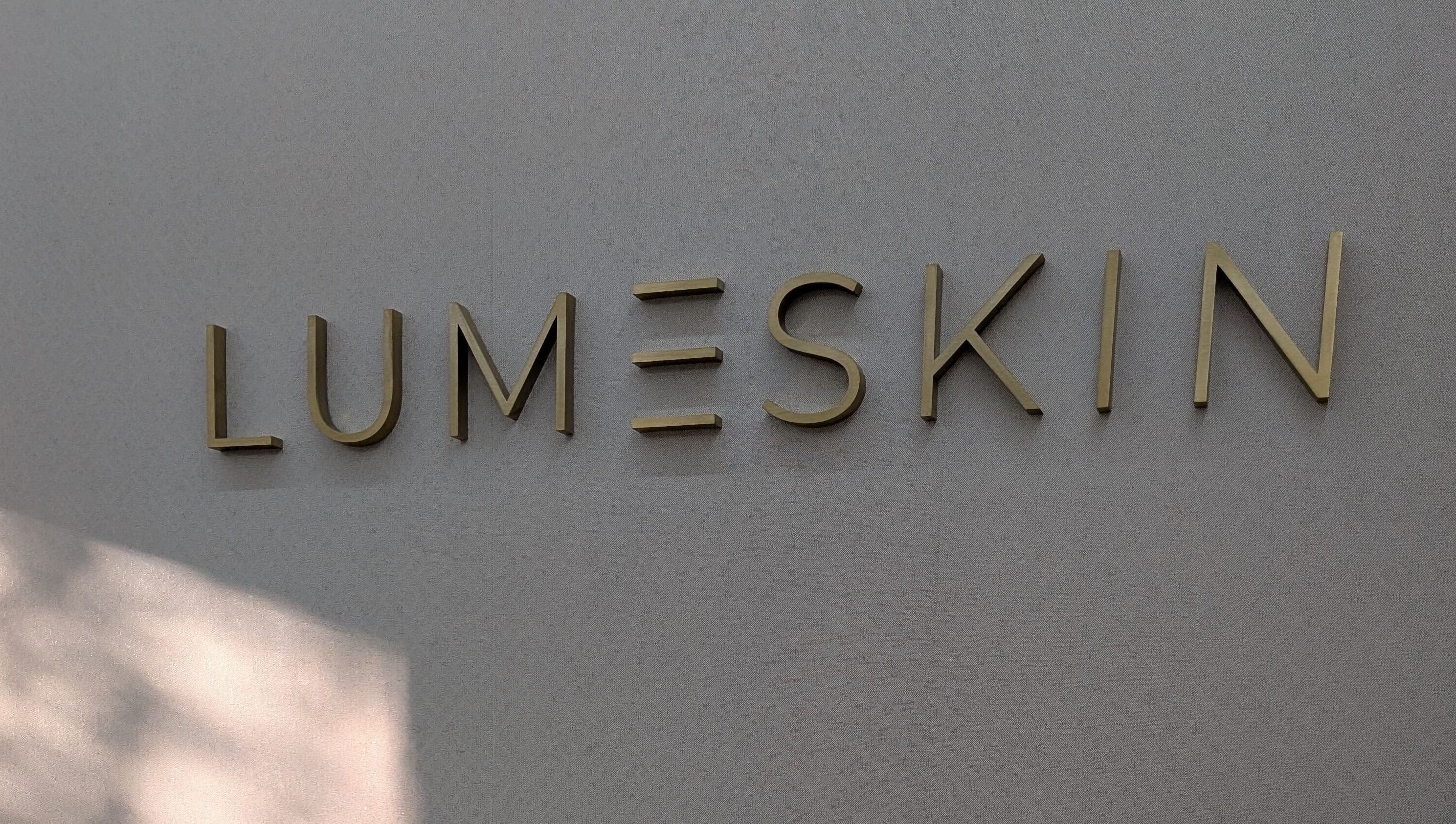 Elegant Lume Skin Aesthetics sign at Diamond Creek, Victoria, AU, showcasing the venue's unique branding.