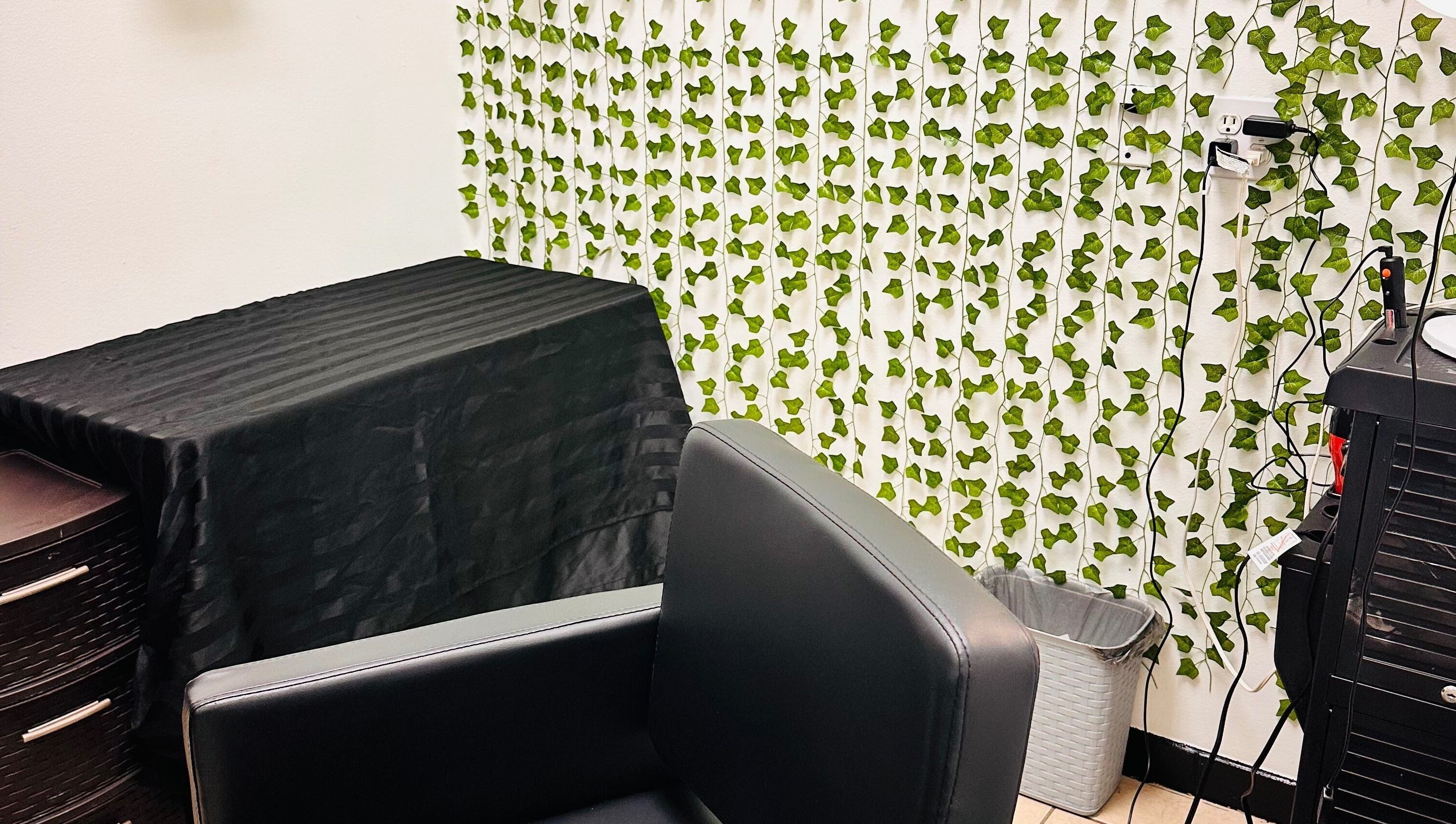 Elegant salon chair and ivy decor at 360 Perfect Beauty, Houston, Texas, US.
