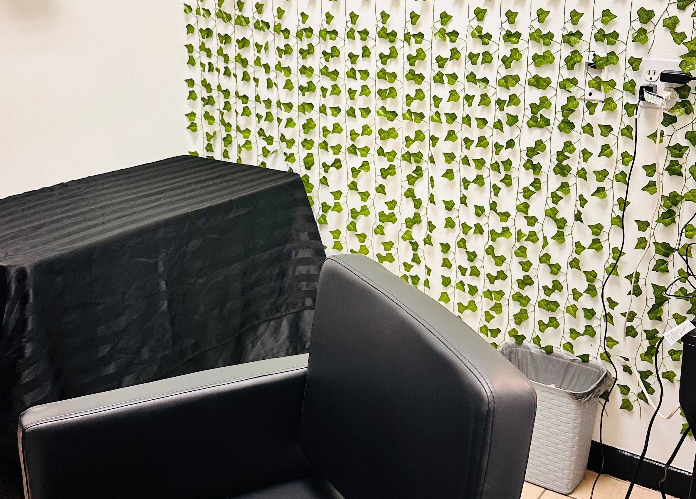 Elegant salon chair and ivy decor at 360 Perfect Beauty, Houston, Texas, US.