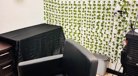 Elegant salon chair and ivy decor at 360 Perfect Beauty, Houston, Texas, US.