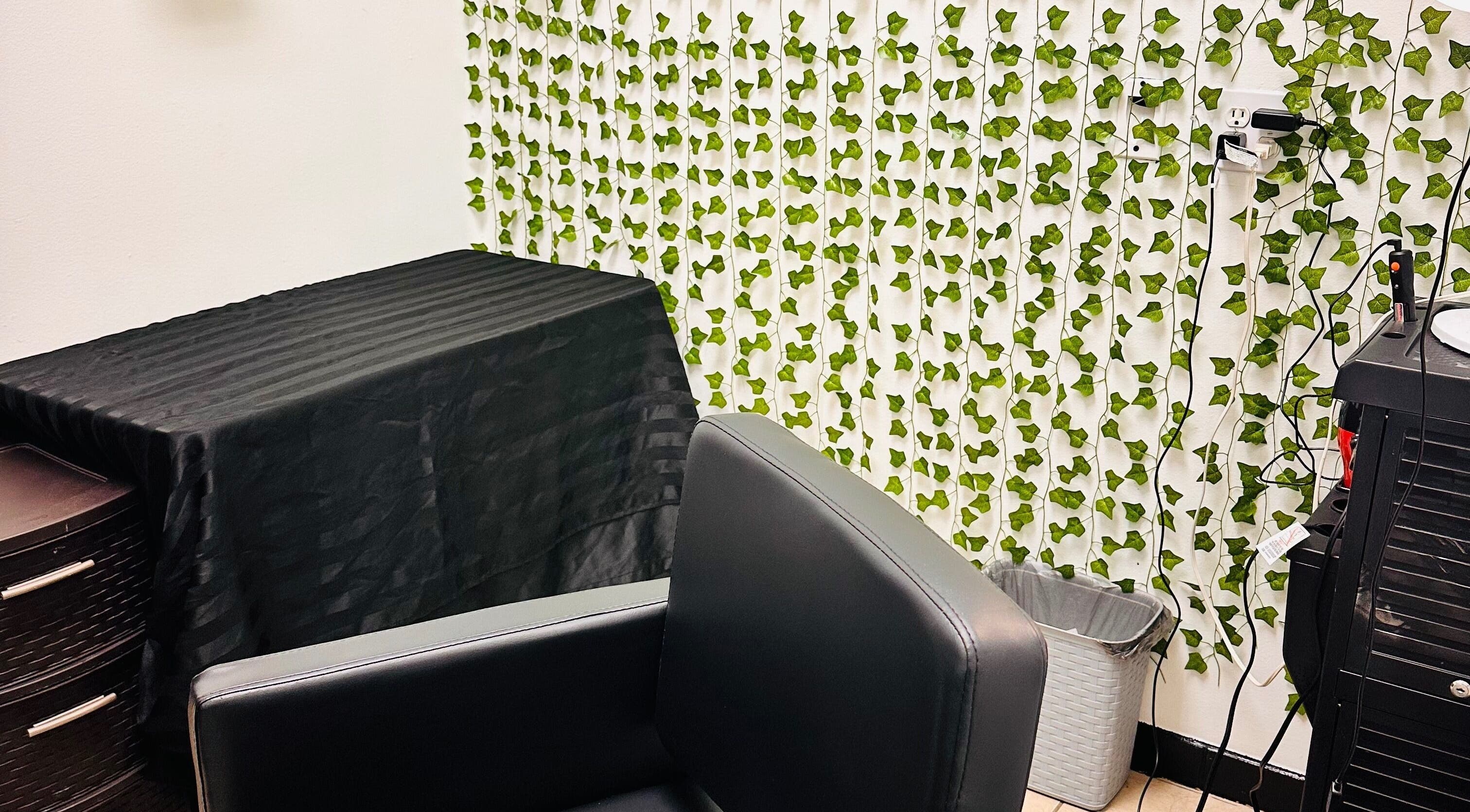Elegant salon chair and ivy decor at 360 Perfect Beauty, Houston, Texas, US.