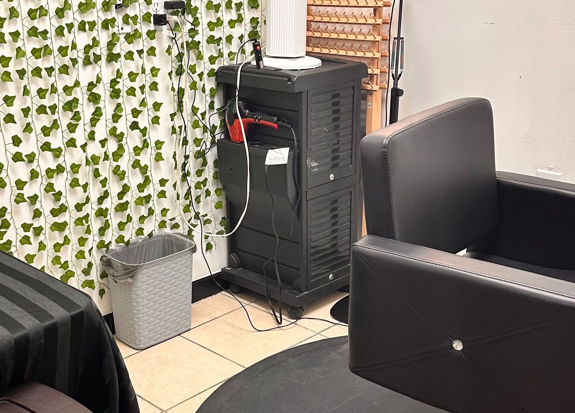 Cozy salon corner at 360 Perfect Beauty in Houston, Texas, US with modern chair and vibrant decor.