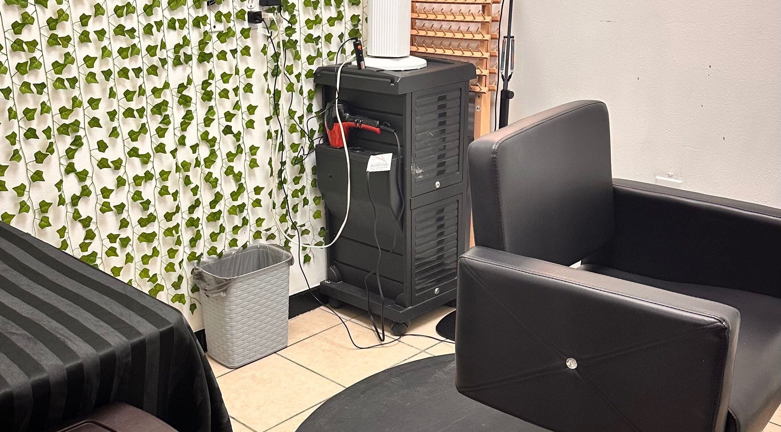 Cozy salon corner at 360 Perfect Beauty in Houston, Texas, US with modern chair and vibrant decor.