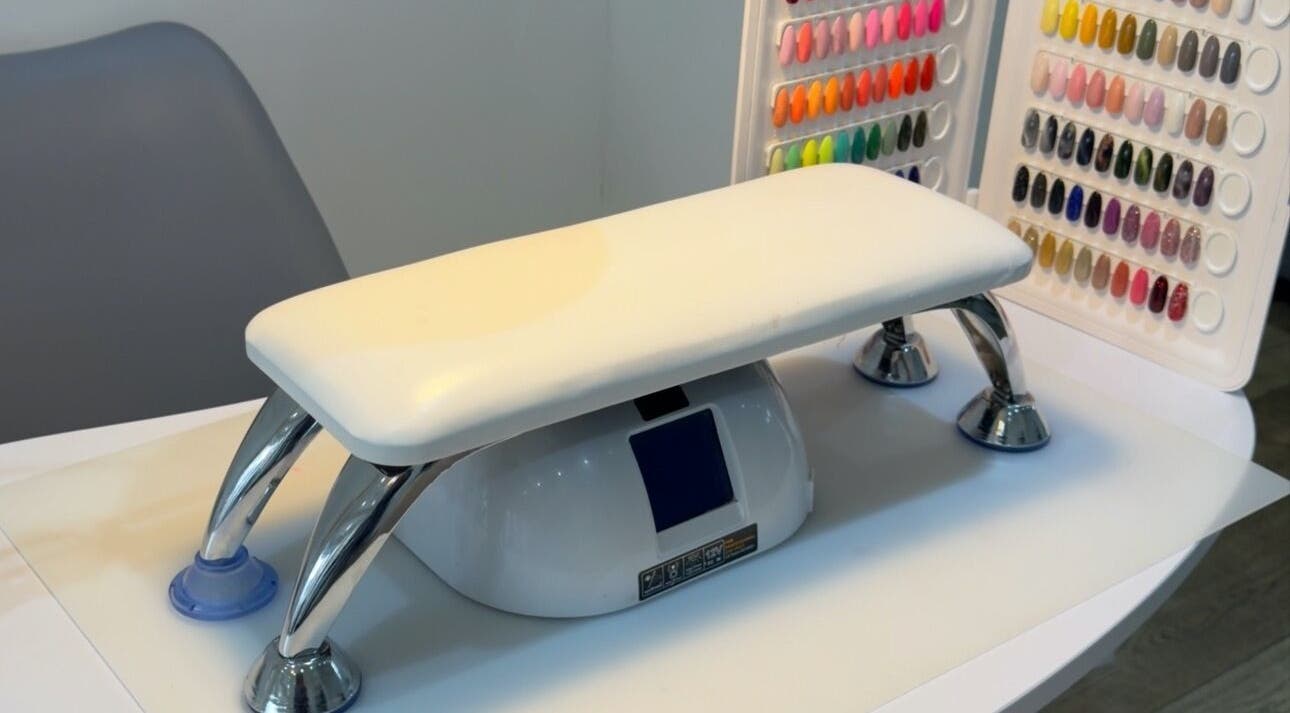 Vibrant nail station at Nails by T, Harlow, England, GB showcasing colorful nail polish options.