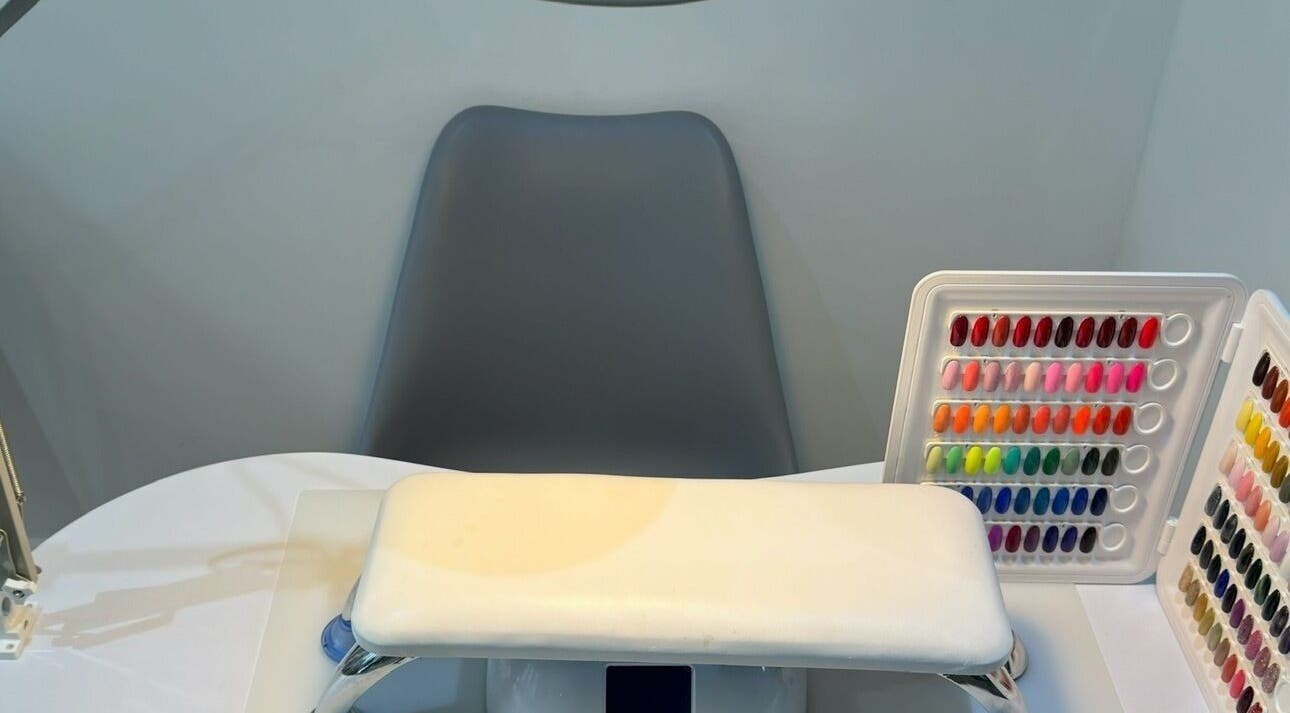 Nail color selection at Nails by T in Harlow, England, GB with a cozy chair and table.