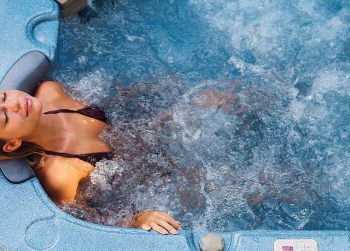 Woman enjoying a hot tub at St. M’s Thera Spa in Twickenham, England, GB.