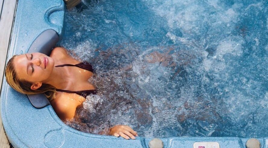 Woman enjoying a hot tub at St. M’s Thera Spa in Twickenham, England, GB.